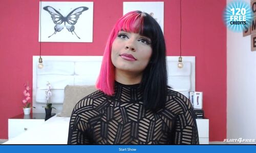 Alternative model shows off her unique pink hair to her guests on Flirt4Free